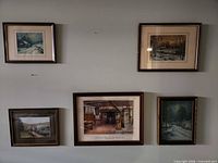 Group shot showing all five framed prints on wall