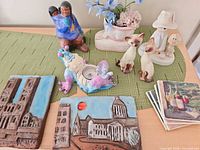 Group shot of all figurines, tiles, tealight holder, planter and coasters