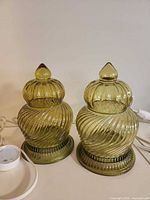 Front view pair ribbed green glass table lamps