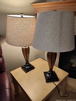 Both lamps on side table, showing bases and shades