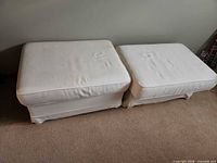 Both ottomans side by side showing tops and overall appearance