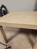 Oblique view of one table showing top and legs