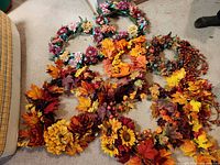 Group view of all fall wreaths laid on carpet