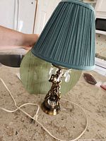 Full view of lamp showing base, shade, cord