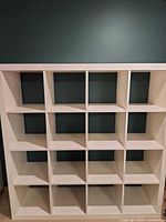 Front view of white cube shelf showing compartments