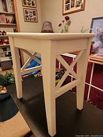 Angled view showing full table, legs, X-brace side