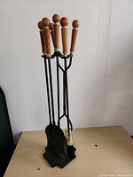 Full view of fireplace tool set on stand