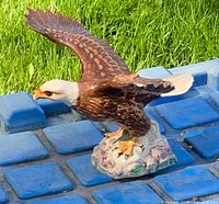 Front left view of ceramic bald eagle figurine