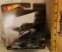 Packaged Hot Wheels Premium ’59 Chevy Delivery front view with card art and ruler for scale