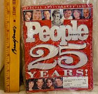 Front cover of March 1999 People Magazine 25th Anniversary Issue next to ruler for scale, sealed in plastic