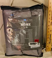 Front view of packaged H.VERSAILTEX blackout curtains showing brand, color, and sealed package