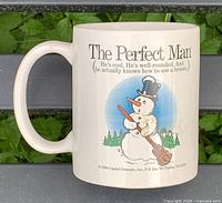 Front view of ceramic mug showing full graphic and text