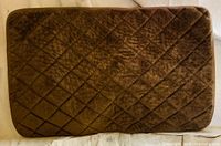 Front view of brown quilted plush bath mat