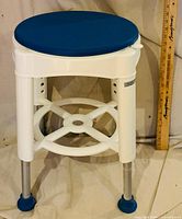 Overall view of shower stool standing upright
