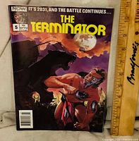 Front cover showing title, issue number, month, price and artwork
