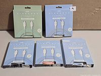 Five boxed Logiix Vibrance Connect cables showing fronts and colour windows