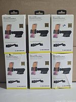 Front view of six boxed Scosche CarMount Extendo mounts