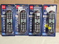 Front view of four packaged RCA Platinum Pro remotes