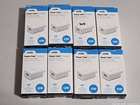 Front view of all eight boxed Logiix chargers