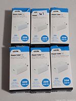 Front view of six boxed Logiix Power Cube 20 chargers