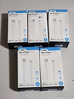 All five boxed Logiix cables grouped on table