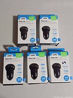 Five boxed Logiix Power Lite 30 Duo chargers