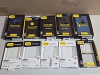 All ten OtterBox cases laid out showing front packaging