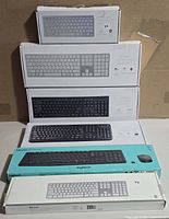 Stacked view of all six boxed keyboards