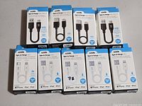 Group shot of nine boxed Logiix cables – four USB-C and five Lightning