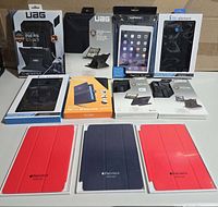 Group shot of all 11 retail-packaged tablet cases and stands