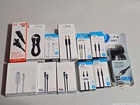 Group shot of all 12 boxed/blistered cables and adapters