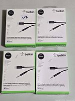 Four Belkin Rockstar 3.5 mm to Lightning audio cable boxes front view