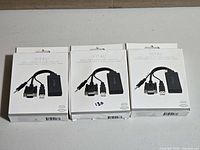 Three boxed Vital VGA + Audio to HDMI adapters front view