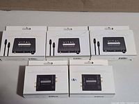 Five boxed Vital digital to analog audio converters arranged in two rows