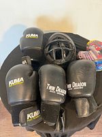 Gloves, face cage and Spider-Man gloves displayed top view