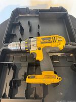 Cordless drill/driver inside open DeWalt case