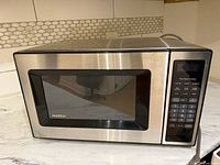Front view of GoldStar stainless steel microwave