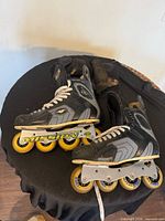 Pair of Mission inline skates showing full boots, wheels and frames
