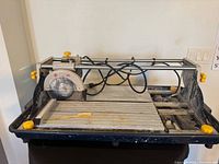 Full view of Mastercraft wet tile saw showing table, saw head, fence and water tray