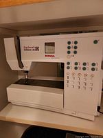 Bernina Patchwork Edition 140 sewing machine in cabinet