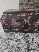 Front view of black lacquered chinoiserie jewelry box closed