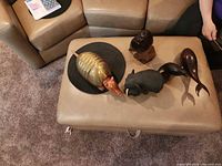 Top view of all five animal sculptures on ottoman