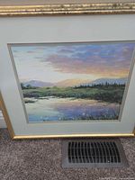 Front view of framed landscape print showing image, mats and gold frame