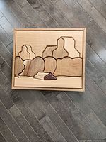 Front view showing geometric wood landscape design