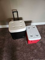 Igloo wheeled cooler and Coleman red cooler side by side
