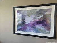 Front view of framed abstract artwork hanging on wall