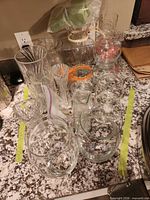 Group shot of all vases on countertop within green tape boundary