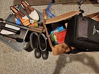 Group shot showing inflator, boots, shoes, kitchen items and soft bag