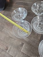 Top view of four coupes with tape measure across bowl showing diameter