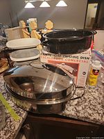 Stainless chafing dish with lid, enamel roaster, 3-tier stand, retail box visible